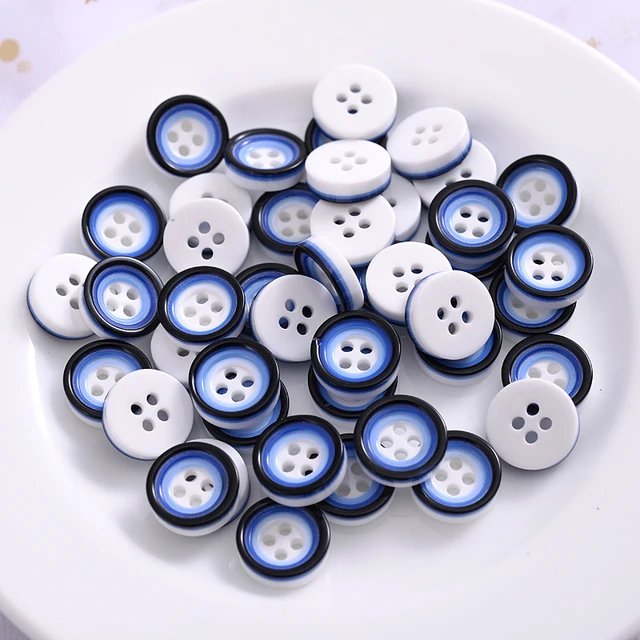 Blå/hvid plastikknap med 4 huller, 12 mm