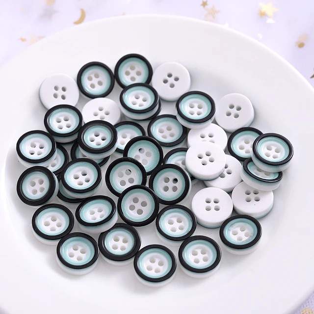 Lyseblå/hvid plastikknap med 4 huller, 12 mm